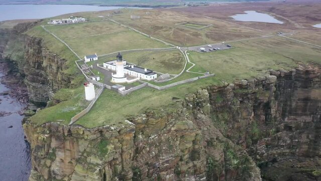 Aerial video of a lighthouse and area at Dunnet Head in Caithness