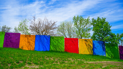 Colorful safety walls and vibrant spring tree buds on the hilltop at Great Bear Ski Valley in South Dakota, USA