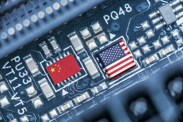 Flag of USA and China on a processor, CPU or GPU microchip on a motherboard. US companies have...
