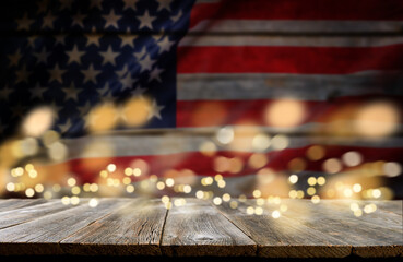 4th of July background. Empty wooden plank table with American USA flag and burning sparkler...