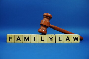 Family Law alphabet letters with wooden blocks alphabet letters and Gavel on blue background