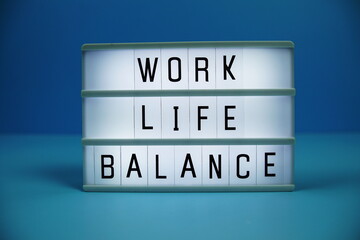 Work Life Balance letterboard text on LED Lightbox on blue background