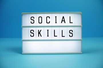 Social Skills letterboard text on LED Lightbox on blue background