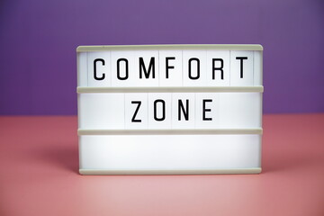 Comfort Zone letterboard text on LED Lightbox on pink and purple background