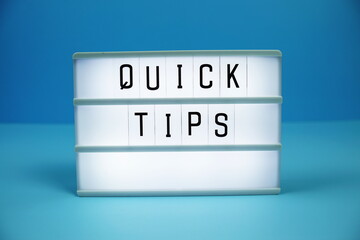 Quick Tips letterboard text on LED Lightbox on blue background