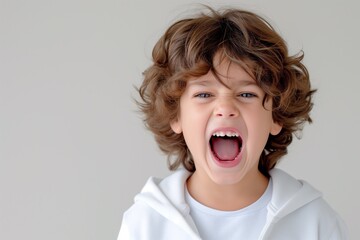 A joyful young boy expressing surprise