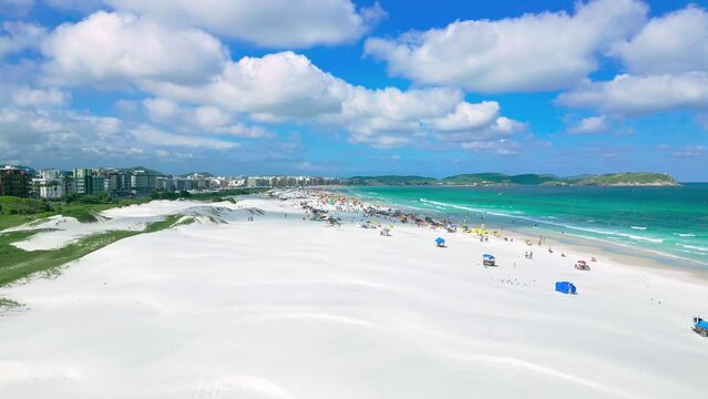 Aerial view of white dunes of the beach Cabo Frio with azure sea in Rio de Janeiro, Brazil.