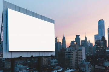 White billboard against a bustling city skyline at dawn, perfect for advertising mockups.