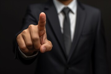 Businessman Pointing Finger Forward in Suit
