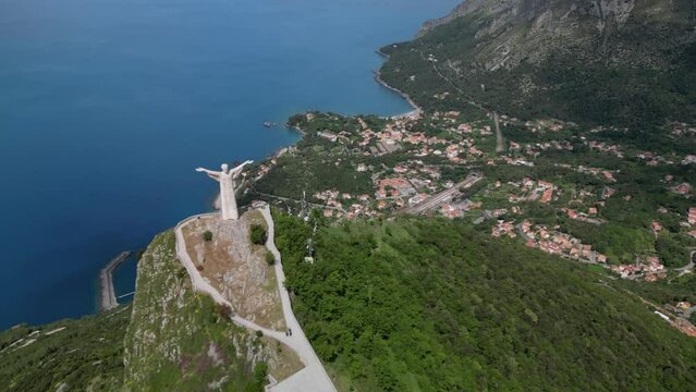 Aerial shot of Christ the Redeemer of Maratea overlooking the cliff,
Italy Basilicata
