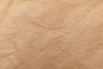 Texture of old crumpled parchment paper. Recycled paper. Kraft packaging material background