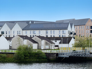 Modern flats built next to old council houses in Govan by the River Clyde