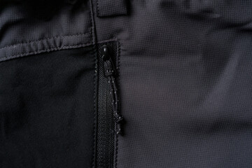 Drawstring zipper of dark gray outdoor trouser pocket