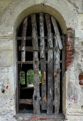 boarded old window in the old wall