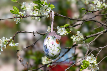 Spring blooming background. Beautiful nature with blossoming tree and solar flare. Spring flowers. Beautiful orchard. Spring, Easter.
