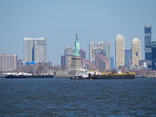 The Statue of Liberty with New Jersey in background