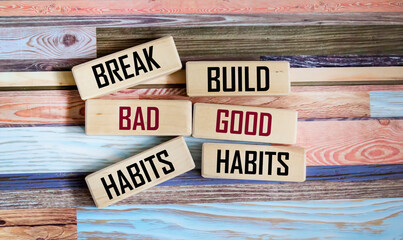 Symbol of good or bad habits. Concept of the word Good Habits Bad Habits on wooden blocks and...