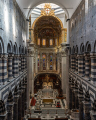 Grand interior of Genova Cathedral with high vaulted ceiling, Liguria, Italy