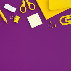 School supplies on purple background. Top view. Back to school. Flat lay.