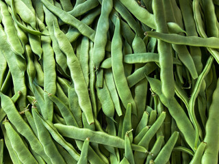 Green beans at the farmers market. Close-up. Nature background.