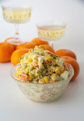 The main salad on the table is olivie. Delicious food and drinks for the occasion of the New Year