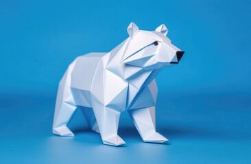 polar bear made of paper on a blue background. An origami figurine.