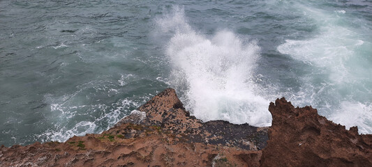 waves crashing on rocks