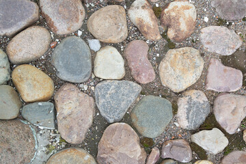 Stone laying.A road made of stones