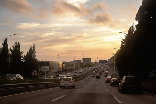 Vehicle traffic at the end of the day with the sunset on the horizon on the inner beltway, VCI, Porto, Portugal.