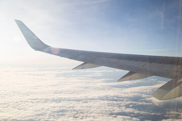 The wing of the aircraft, the view from the window of the aircraft.