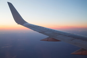 Fototapeta premium The wing of the aircraft, the view from the window of the aircraft.