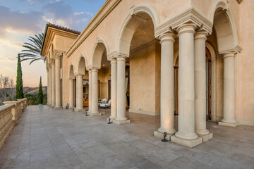 Classic Building With Columns and Parked Car