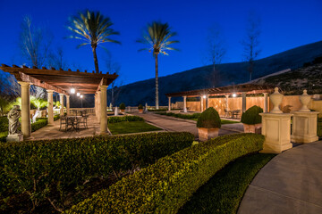 Obraz premium Nighttime Outdoor Dining Area With Gazebo