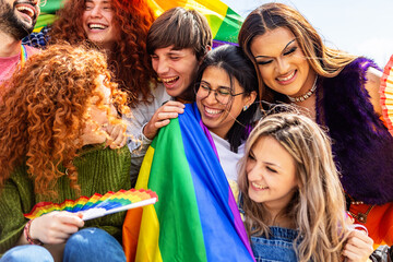 LGBT community people with rainbow flag celebrating gay pride day festival. Gay and lesbian people...