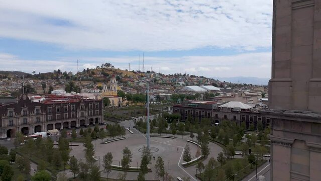 Aerial Journey Over Toluca, Revealing the Magnificent Cathedral and its Central Plaza, Adjacent to the Stately Legislative Palace, Offering a Glimpse of Toluca's Historical and Political Hub