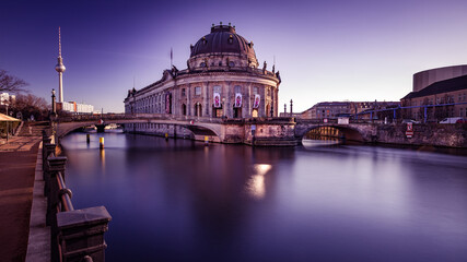 Fototapeta premium Bode Museum at Sunset, Reflective Spree River View, Berlin's Iconic Cityscape