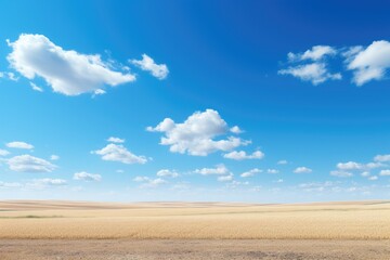 Fluffy white clouds dotting a bright blue sky, Serene blue sky with wispy white clouds.