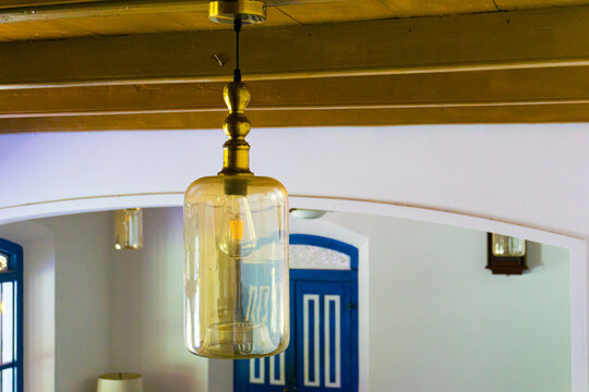 Old hanging lamp inside the colonial house - Powered by Adobe