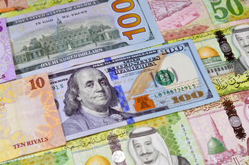 American USD money dollars bills, Saudi Arabia money banknotes bill of different values, 100, 50,...