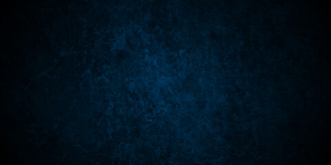 Dark blue stone wall blank backdrop light design. Dark blue or black slate background rock distress texture. High Resolution on dark black  and blue Cement Texture Background.