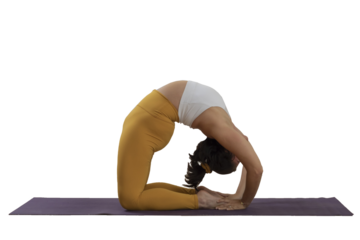 Woman practicing yoga does a backbend on the floor holding her feet, with a namaste sign in the background