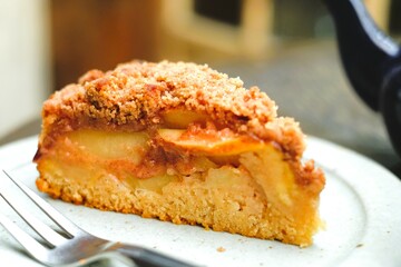 piece of apple crumble cake on the plate