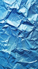 Obraz premium Detailed view of crumpled blue wrapping paper or foil