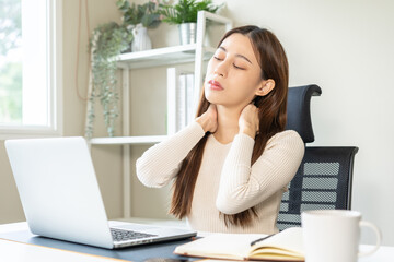 Body muscles stiff problem, ache asian young woman, girl pain neck while sitting work on chair at...