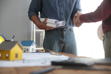 Handshake. Close up construction worker people shaking hands on business cooperation agreement. Successful hands shaking after good deal