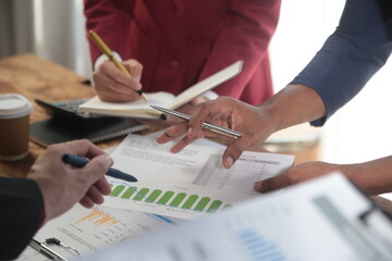 Business team meeting working with new startup project, discussion and analysis data the charts and...