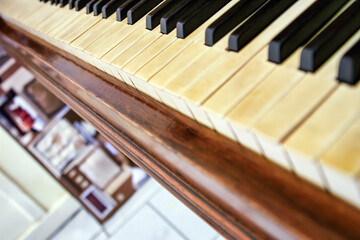 old piano keyboard view from the top, dutch angle