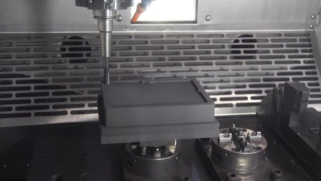 The CNC milling machine rough cutting the graphite electrode parts by flat end mill tool.