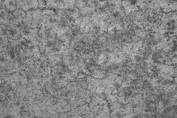 Dirty old cracked concrete floor texture background. Black mould on cement surface. Grunge and...
