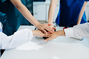 Team Doctors nurses union coordinate hands Teamwork Concept in hospital for success and trust